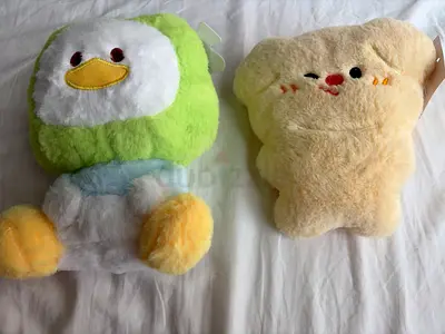 Two cute plush toys (duck and smiling biscuit) - good used condition