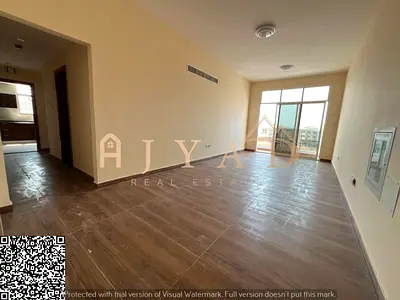 Annual rental: 2BR apartment in Al Muweihat 3, 3 baths, balcony, central AC, built-in wardrobes, free month, flexible payments, prime location.