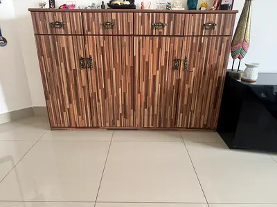 Wood-tone storage cabinet with 3 drawers and 4 doors - good condition