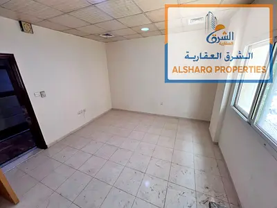 Stop here! Studio Al Nuaimiya 3, behind Al Safir Mall, with a large area, ground floor, central air conditioning, and a prime location. Only 18,000 AE