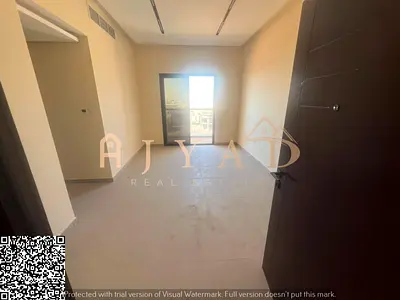 Annual rental in Al Jurf 3, Ajman: brand-new 2BR apartment, 2 baths, balcony, central AC, built-in wardrobes, near Dubai & Sharjah exits.