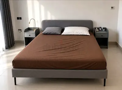 Gray Upholstered Double Bed with Headboard and Matching Nightstands