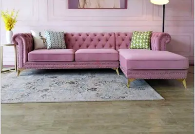 Pink velvet L-shaped Chesterfield sofa with chaise
