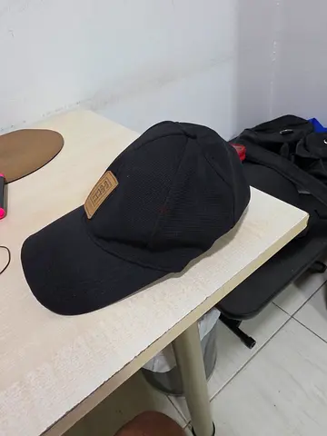 Black casual cap with leather patch - gently used COD only. No delivery