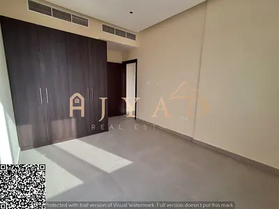 Annual rental in Ajman: brand-new 1BR apartment with wardrobes, balcony, central AC, 1 month free, near Dubai & Sharjah exits and services.