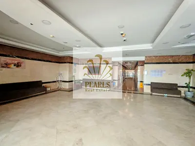 1BR + hall for annual rent in Emirates Towers, prime location, 2 bathrooms, parking, AED 30K yearly. Under maintenance, 4 payments, cheque deposit.