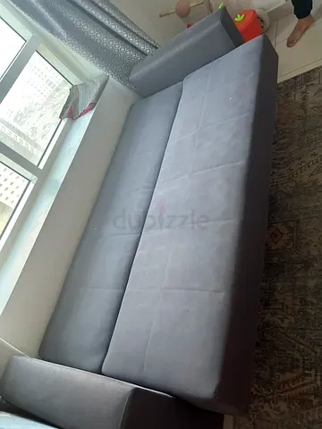 Dark grey sofa come bed with storage in good condition