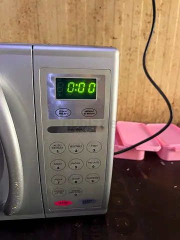Used Silver Countertop Microwave Oven - Good Working Condition