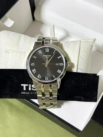Tissot stainless steel men's dress watch with Roman numerals