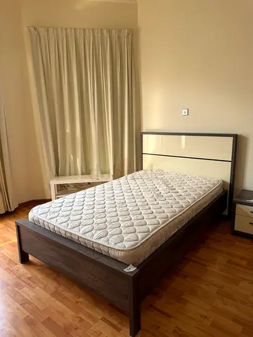 Queen wooden bed frame with mattress and bedside table - good condition