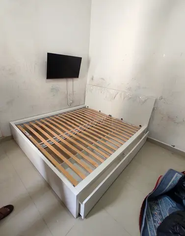 IKEA malam king size bed with 2 storage drawers and an IKEA mattress
