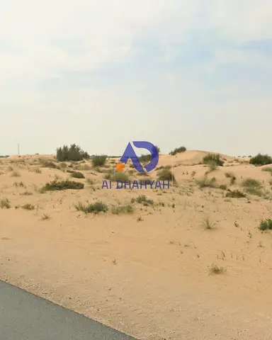 Land for sale in Tilal; prime location and price, close to amenities.