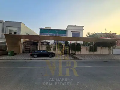 Villa for sale in Ajman, Al Zahiyah area, 6025 sq ft, 5 master bedrooms with a roof terrace, price