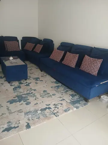 Blue velvet L-shaped sofa set with ottoman - good condition 9 seats