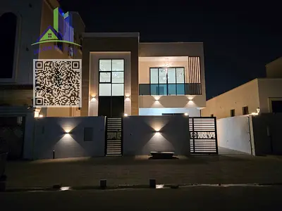 Luxury villa for sale in Al Yasmeen, Ajman, featuring 6 master bedrooms with built-in wardrobes, majlis, family living room, main and prep kitchens, s