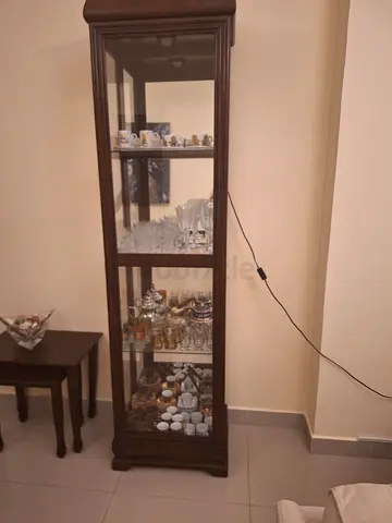Tall wooden glass display cabinet with shelves - good condition