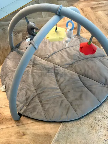 Gray plush baby play gym/mat with hanging toys - used