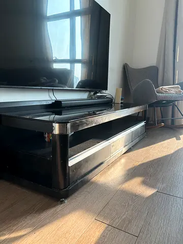 Low black TV stand / entertainment unit with storage