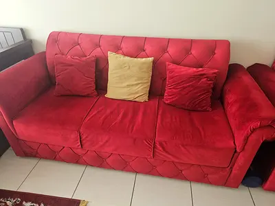 Red 7-seater fabric sofa in excellent used condition