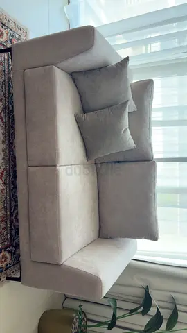 Light grey two-seater sofa in good condition