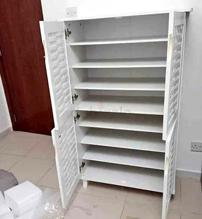 White Shutter-Style Storage Cabinet with Multiple Shelves - Good Condition