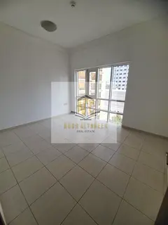 Upscale two-bedroom apartment with a living room in Al Majaz 1.