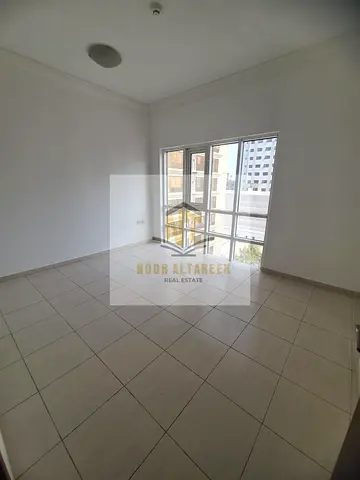 Upscale two-bedroom apartment with a living room in Al Majaz 1.