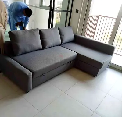 Grey L-shaped Fabric Sofa bed with Storage - Good Condition