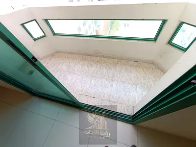 One bedroom apartment for annual rent in Al Qasimia Al Mahatta Sharjah, master bedroom, spacious living room with balcony and open view, 2 bathrooms,