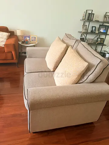 Comfortable 2- seater beige fabric sofa in great condition