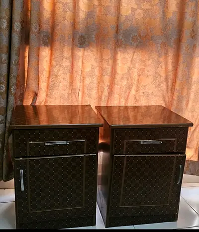 Pair of dark brown bedside cabinets with drawers and doors