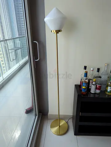 Slim gold floor lamp with white glass shade - modern standing lamp