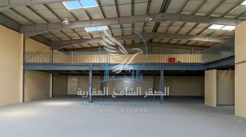 warehouse in Al Sajaa with G+M layout, 44 kW 3-phase power, concrete flooring, kitchen, bathrooms, 10,000 sq. ft. ,and fire system.