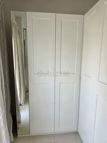 White Built-in Double Wardrobe with Paneled Doors (Corner) - plenty of space.