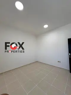 2BR + Hall for annual rent in Al Nuaimiya 1, Ajman. Open-view balcony, spacious layout, 2 bathrooms.