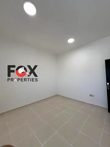 2BR + Hall for annual rent in Al Nuaimiya 1, Ajman. Open-view balcony, spacious layout, 2 bathrooms. AED 36K, 4 payments, AED 2K cash deposit. Familie