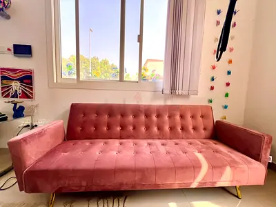 Pink velvet 3-seater sofa bed with gold legs - very good condition