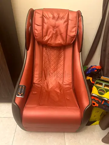 Used brown faux-leather full-body massage chair with remote control