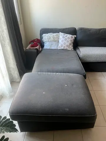 Grey L-shaped fabric sofa with ottoman - good used condition