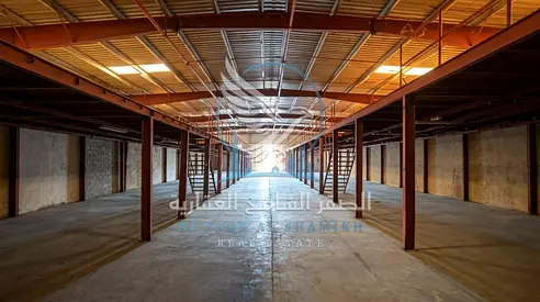Warehouse in Industrial Area 11, 8,000 sq. ft. with 5,000 sq. ft. ground floor, 3,000 sq. ft. mezzanine, single-phase power and main road location.