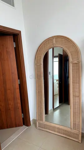 Full-length arched rattan framed standing mirror - The Attic
