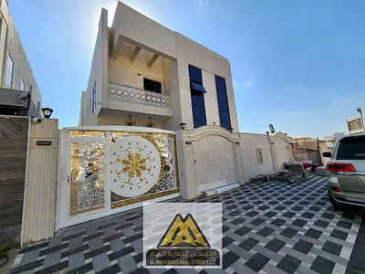 Luxury villa for sale in Al Yasmin, Ajman | 5 bedrooms, 7 bathrooms, majlis, spacious living room, maid's room, and high-end finishing