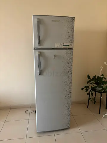 Silver Two-Door Refrigerator - Good Working Condition