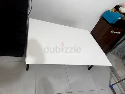 White rectangular coffee table with black legs - good condition open and close table