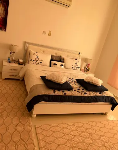 White double bed with mattress and matching bedside tables - good condition