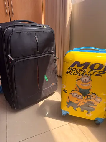 Large black expandable suitcase with front pockets + kids Minions trolley (set of 2)