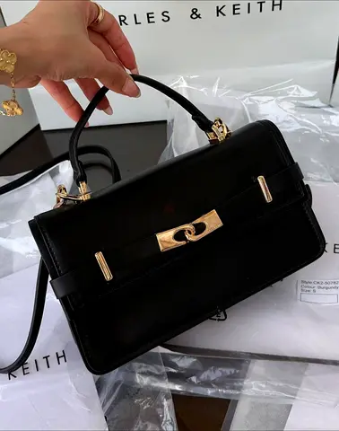 Black top-handle Charles & Keith leather crossbody bag - elegant everyday size