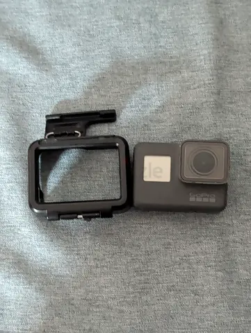 GoPro HERO 5 action camera with protective frame mount - used