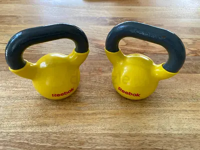 Pair of Yellow Reebok 5kg Kettlebells - 10kg total