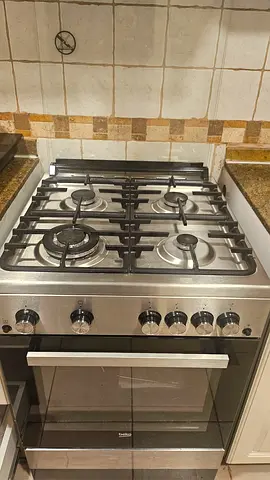 BEKO Stainless Steel 4-Burner Gas Cooker with Built-in Oven - Good Condition